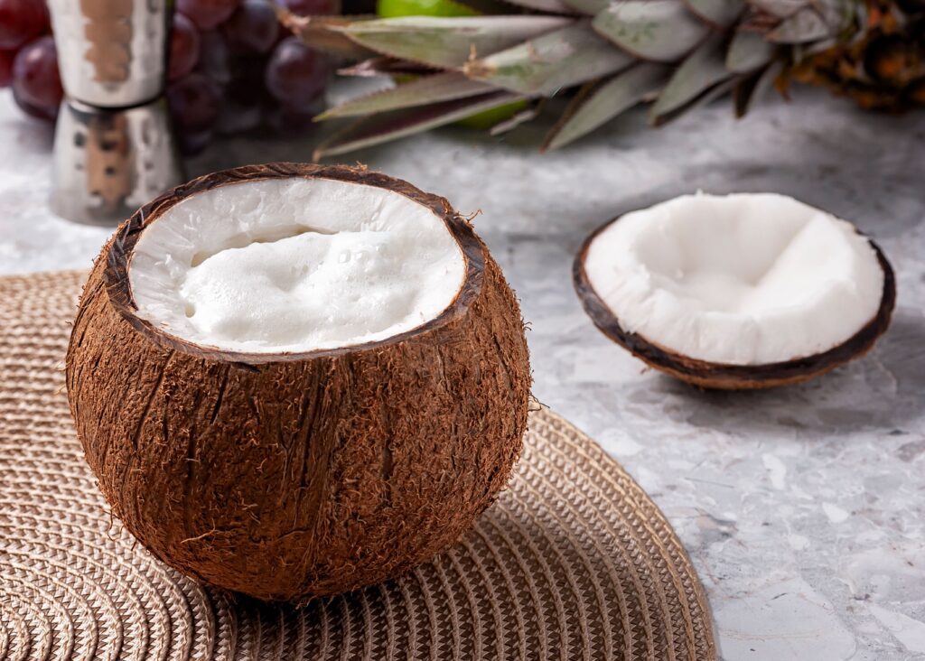 A refreshing pina colada garnished with fresh pineapple slices, ideal for tropical settings.